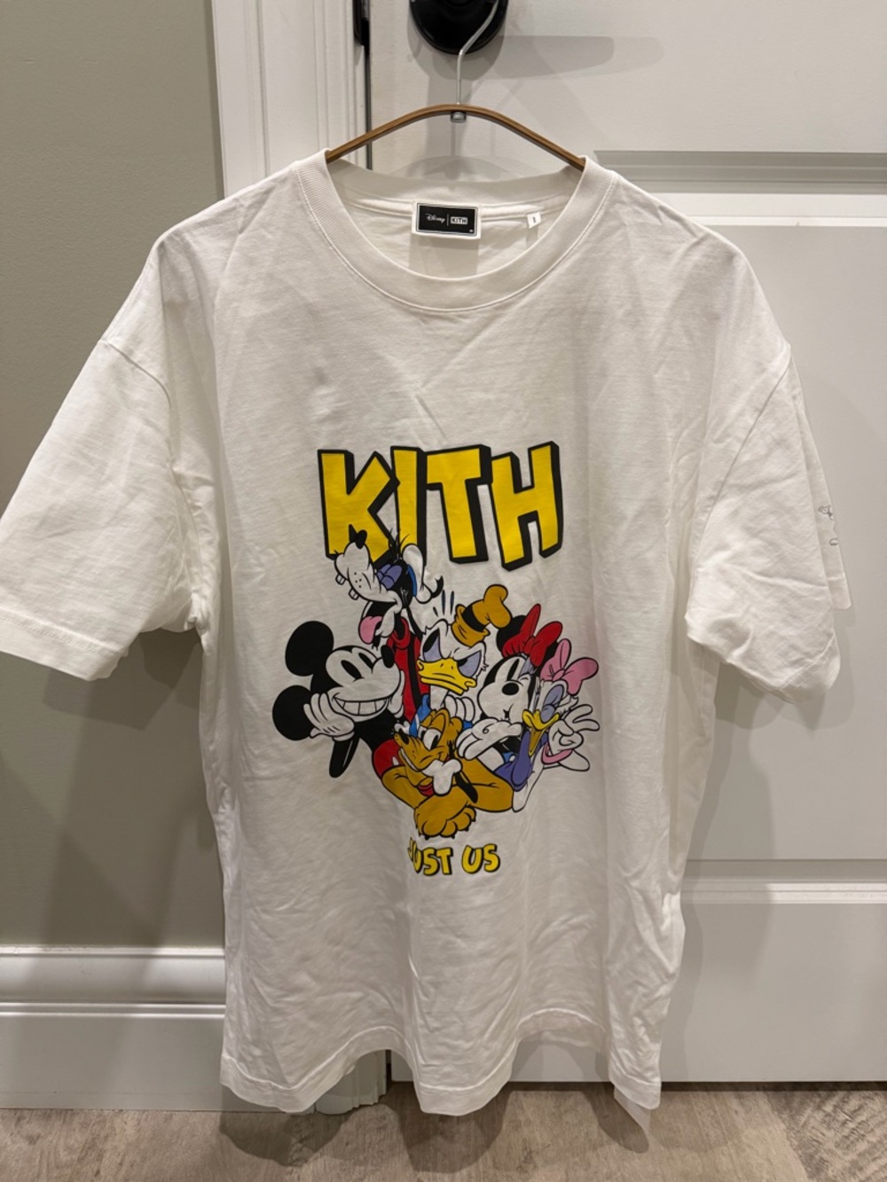 Kith White Graphic Tee with Yellow Logo and Multicolor Disney Print